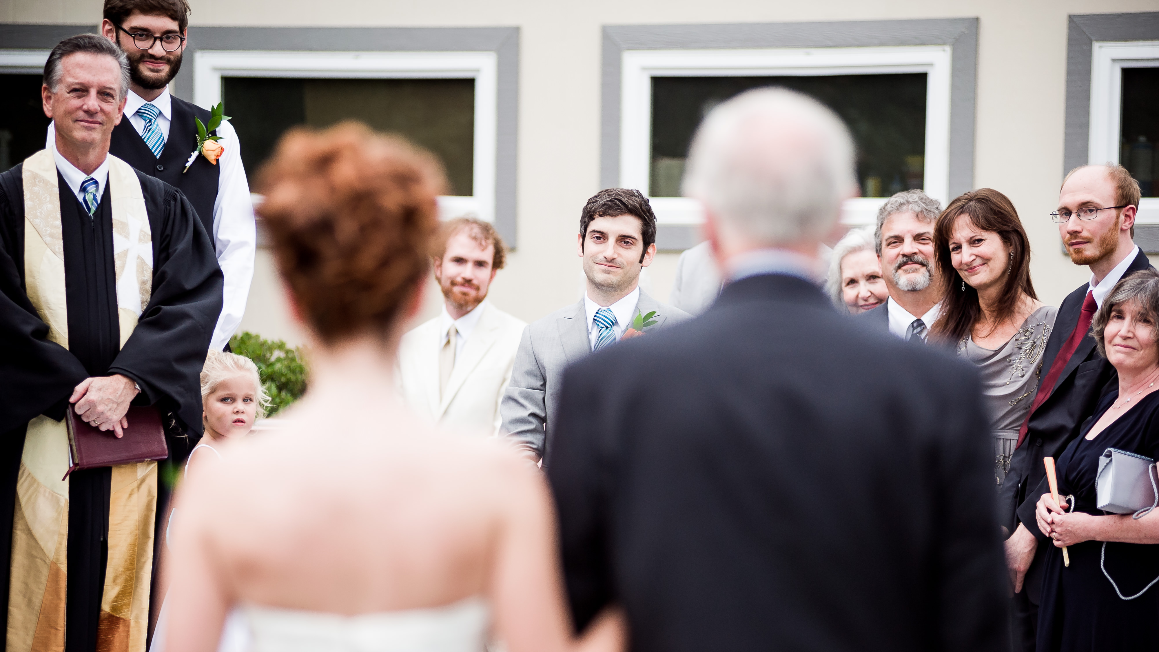 Sweet moment of groom seeing bride walk down the aisle