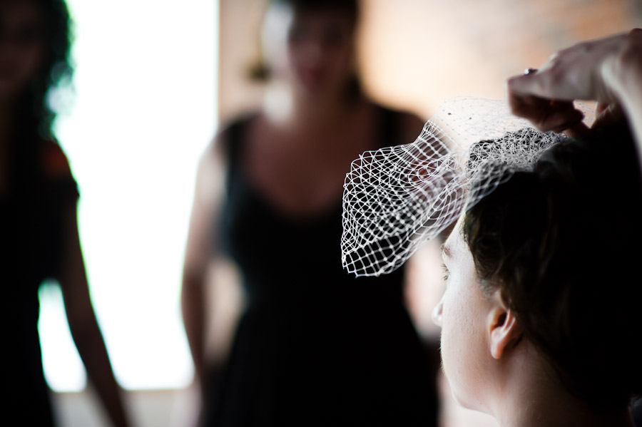 bride putting veil on