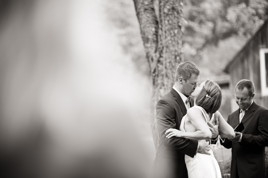 story-inn-wedding-brooke-hank-12 first kiss at outdoor wedding in brown county indiana