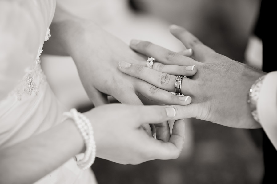ritz-charles-wedding-photography-DE-12 bride and groom looking at wedding rings