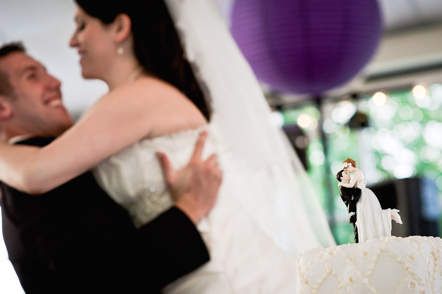 ritz-charles-wedding-photography-DE-17 funny pick of bride and groom and cake topper