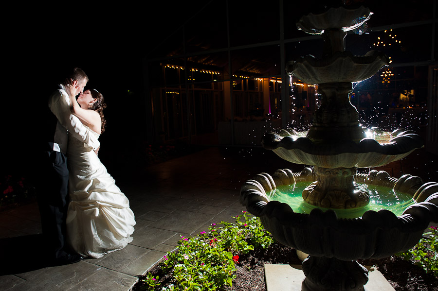 ritz-charles-wedding-photography-DE-23 elegant strobist portrait of bride and groom at night next to fountain