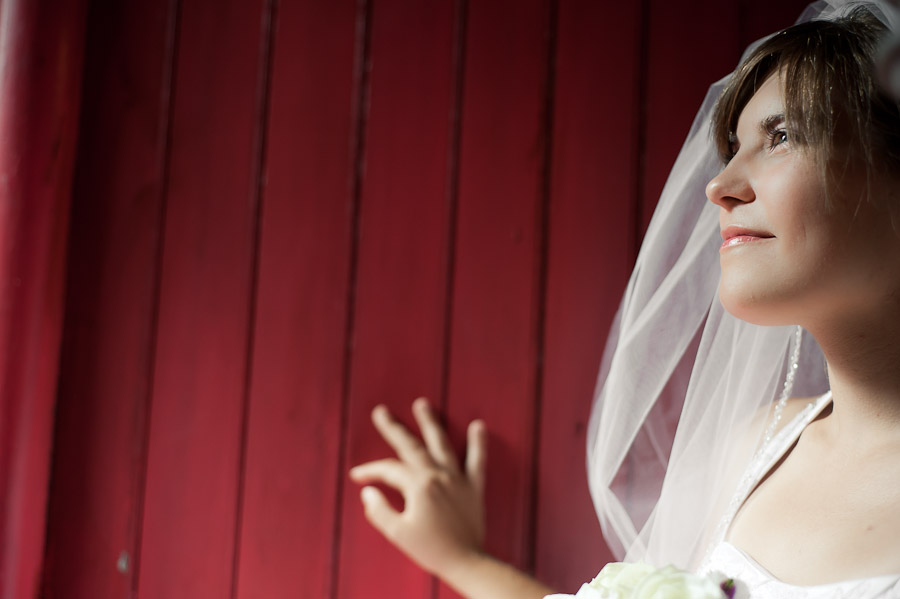 boston-church-advent-sheraton-commander-wedding-photography-9 stunning bridal portrait against red wall