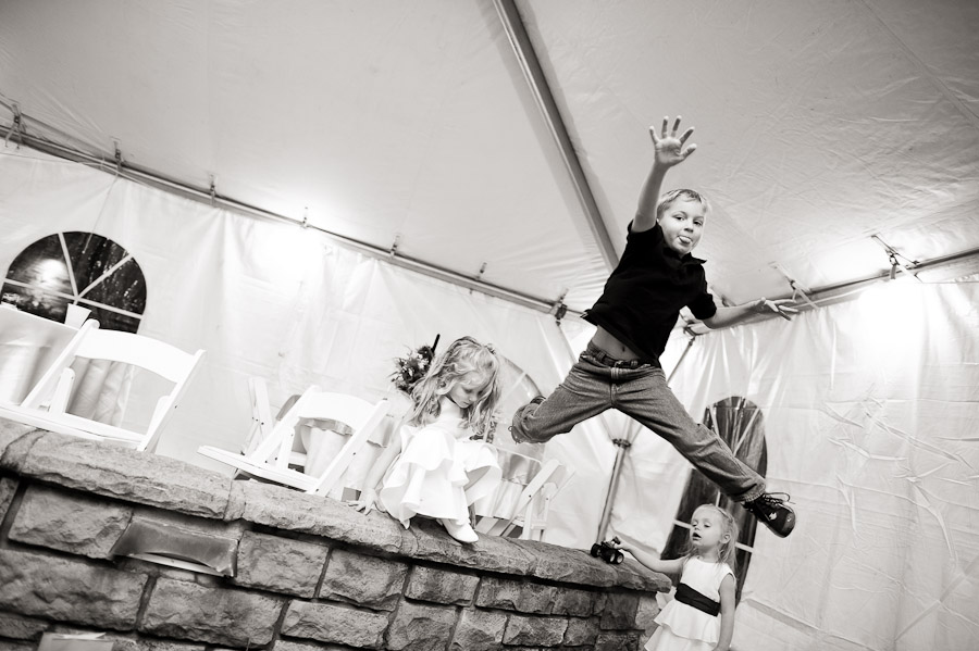 Deer-Park-Manor-Wedding-Photography-Bloomington-IN-Stacey-Jake-10 sweet jump by kid at wedding