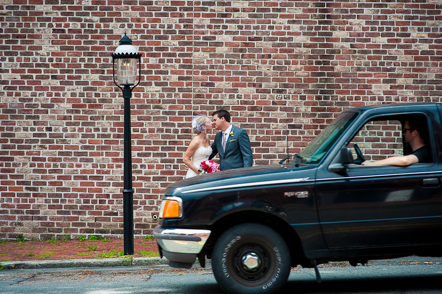 Funny portrait of bride and groom with passerby in car