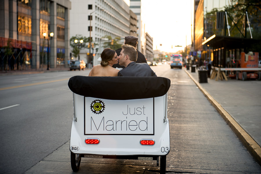 Romantic sunset kiss on pedi-cab in downtown Indianapolis