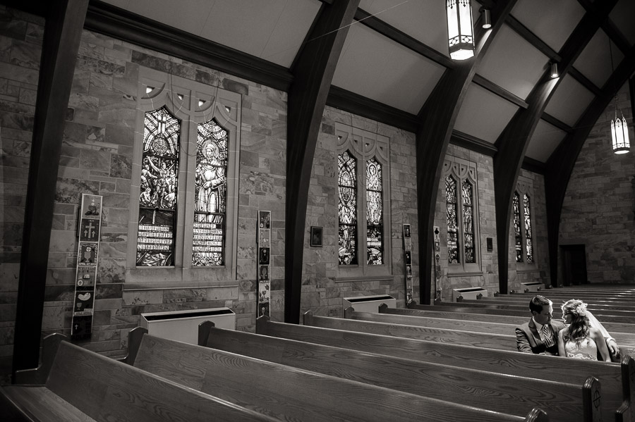 Indianapolis-Purgatory-Golf-Club-Noblesville-Wedding-Photography-Steph-Drew-08 romantic, quiet wedding moment in sanctuary of Immaculate heart of st. mary in Indiana
