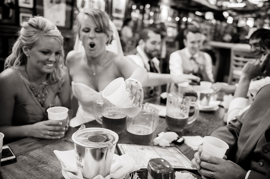 Upland-Brewery-Indiana-University-Bloomington-Wedding-Lydia-John-09 Bride and groom sinking the biz at Nick's on their wedding day in Bloomington, Indiana