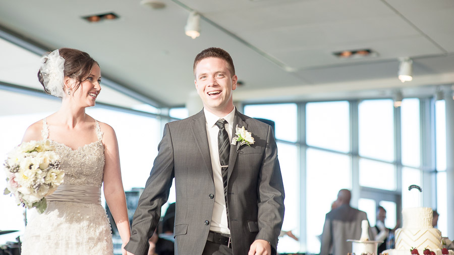 Muhammad-Ali-Center-Wedding-Photography-Louisville-Kentucky-Megan-Ryan-08 Bride and groom entering wedding reception at Ali Center in Louisville