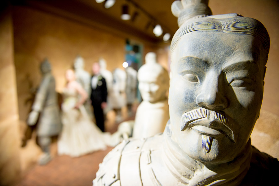 Indianapolis-Childrens-Museum-Wedding-Photography-Rebecca-Nathan-08 Hilarious wedding portrait of bride and groom in children's museum with statues