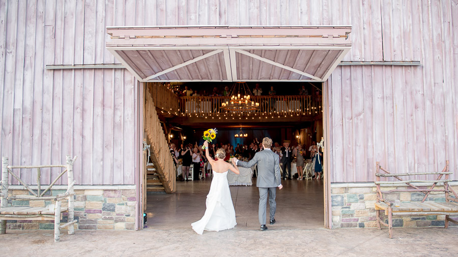 fun and dramatic bride and groom entrance into ceremony at County Line Orchard wedding