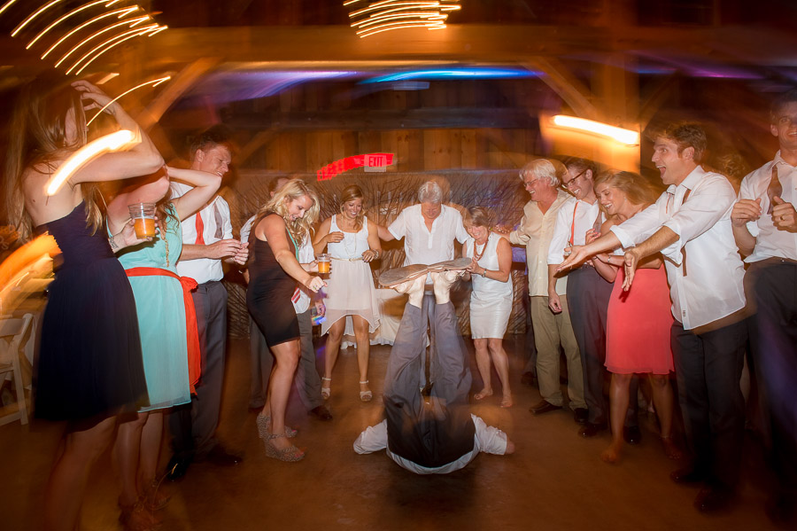 Funny wedding dance floor photo of dude doing the worm 