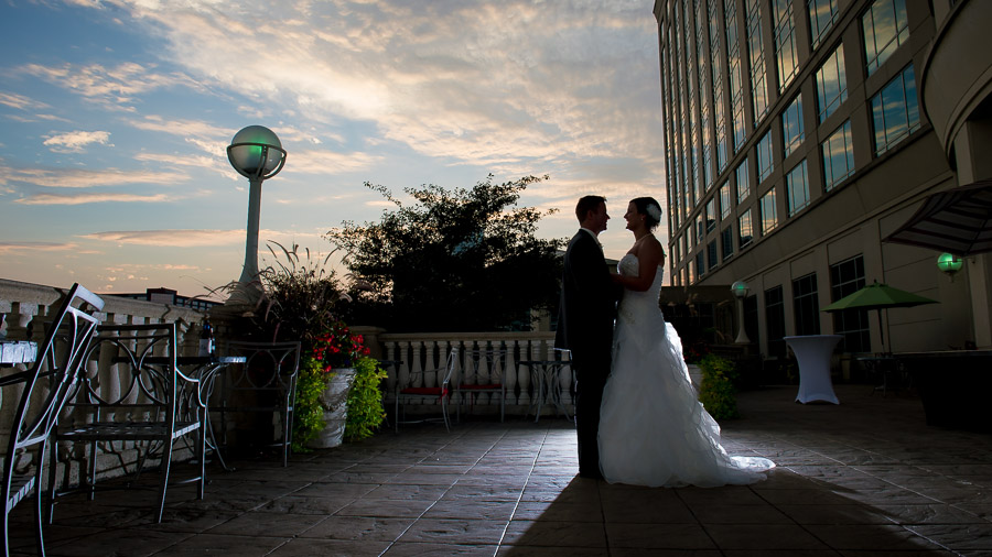Indianapolis-Marriott-North-Indiana-Wedding-Ashleigh-Jake-07 beautiful sunset photo of bride and groom on terrace at Indiana wedding