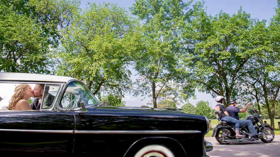 Bloomington-Indianapolis-Wedding-Photographers-2013-Favorite-Photos-of-the-Year-53 Awesome wedding portrait in classic car with motorcycle photobomb in Indiana