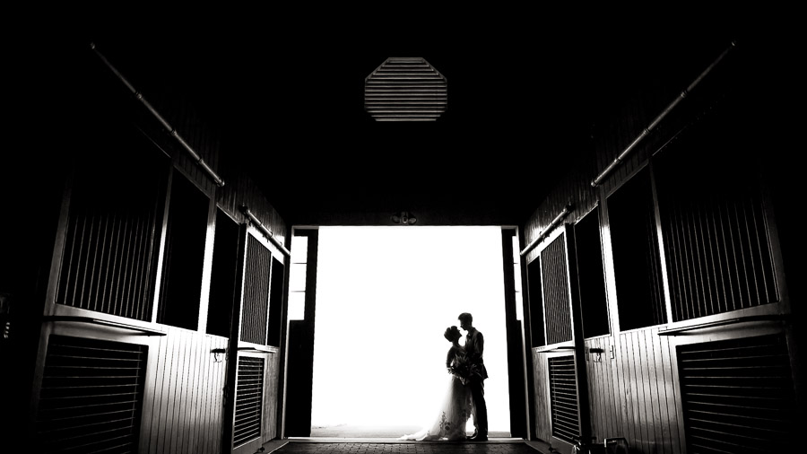Beautiful black and white barn silhouette with bride and groom at King Family Vineyard