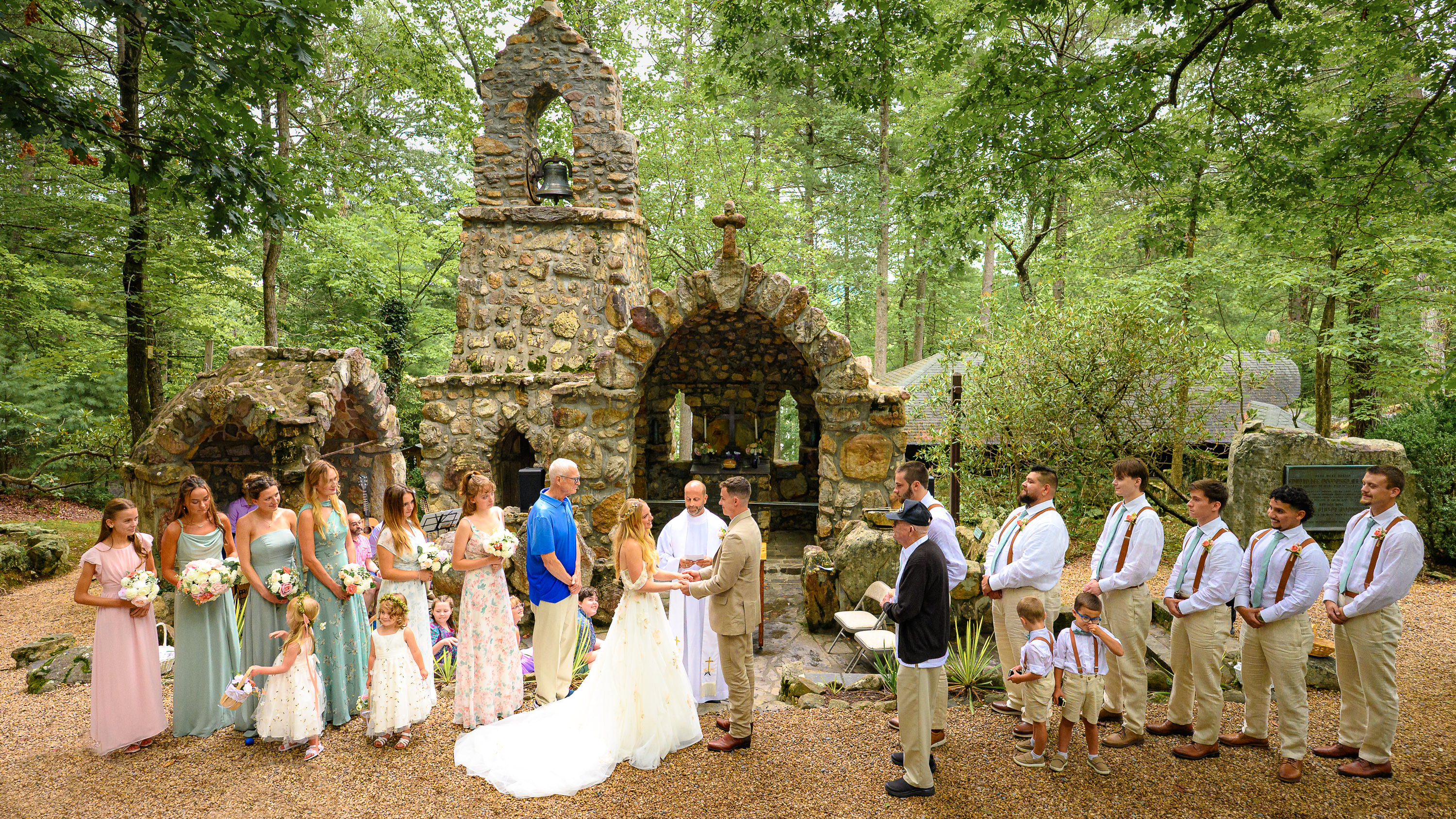 Wedding party in front of the shrine at their Shrine Mont wedding photography in Orkney Springs